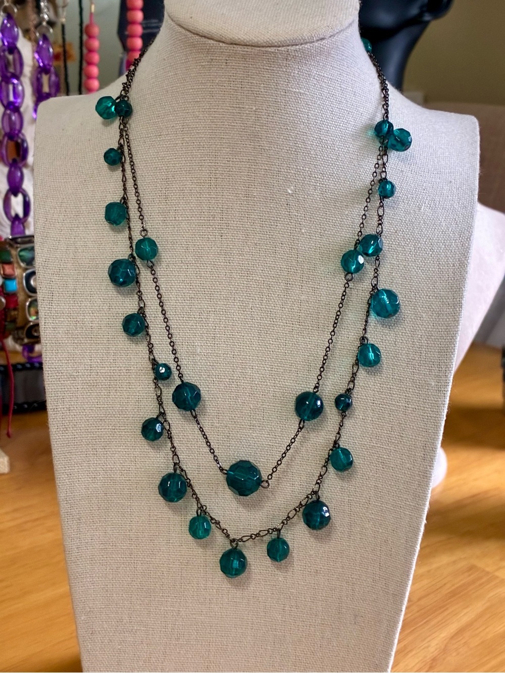 This item is a vintage-style layered costume necklace.